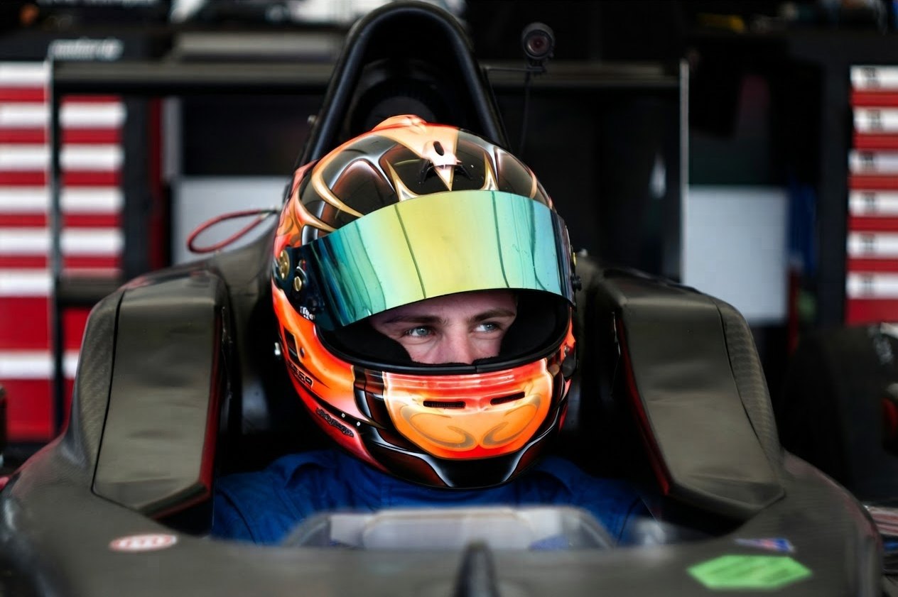 Young driver in a Formula car